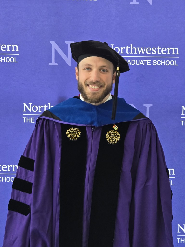 A picture of me from my 2025 hooding ceremony.